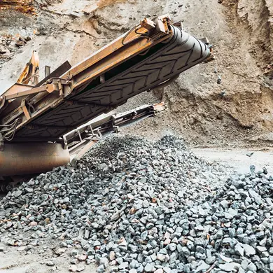 Stone crusher creating crushed stones